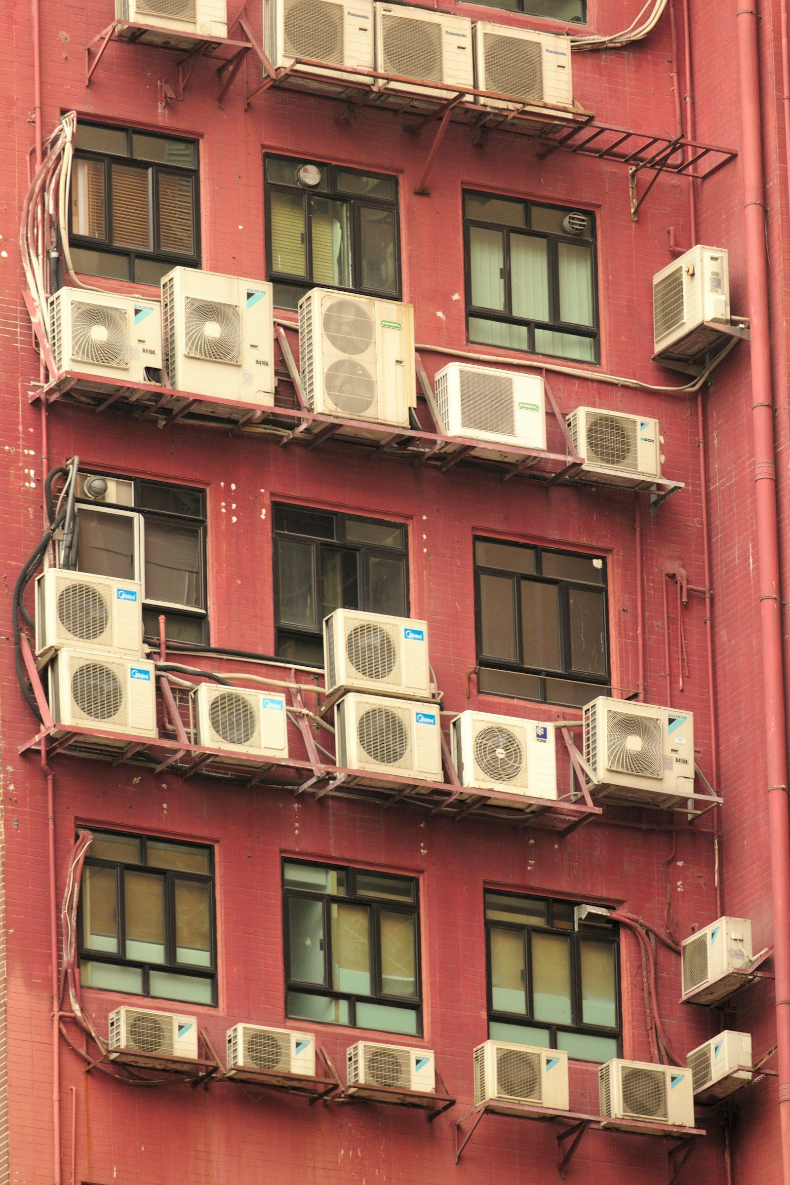 Apartment building with many AC units